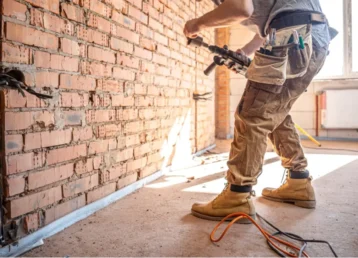 handyman-construction-site-process-drilling-wall-with-perforator-2-min