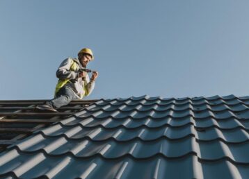 long-shot-man-working-roof-min